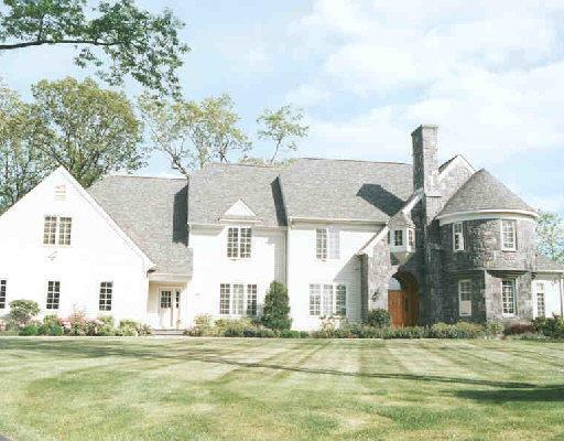 34 Wild Turkey Court Ridgefield, CT 06877 - Photo 1 of 1 a front view of a house with a garden