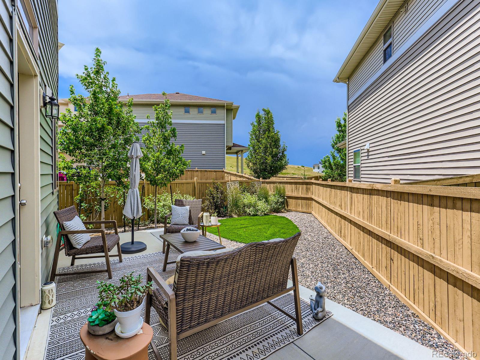a view of a patio in backyard