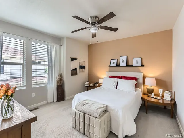 a bedroom with a bed and window