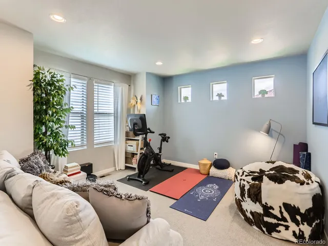 a bedroom with furniture and a window