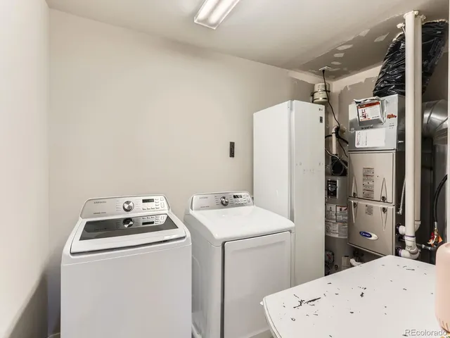 a utility room with dryer and washer