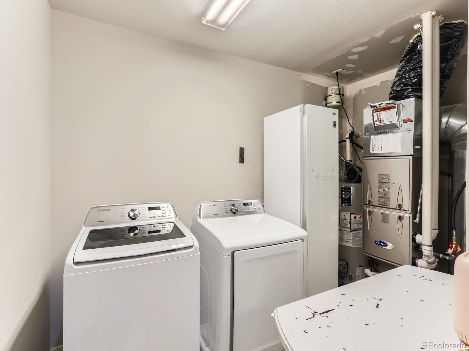 2899 Merry Rest Way Castle Rock, CO 80109 - Photo 25 of 39 a utility room with dryer and washer