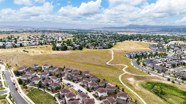 an aerial view of residential building and lake