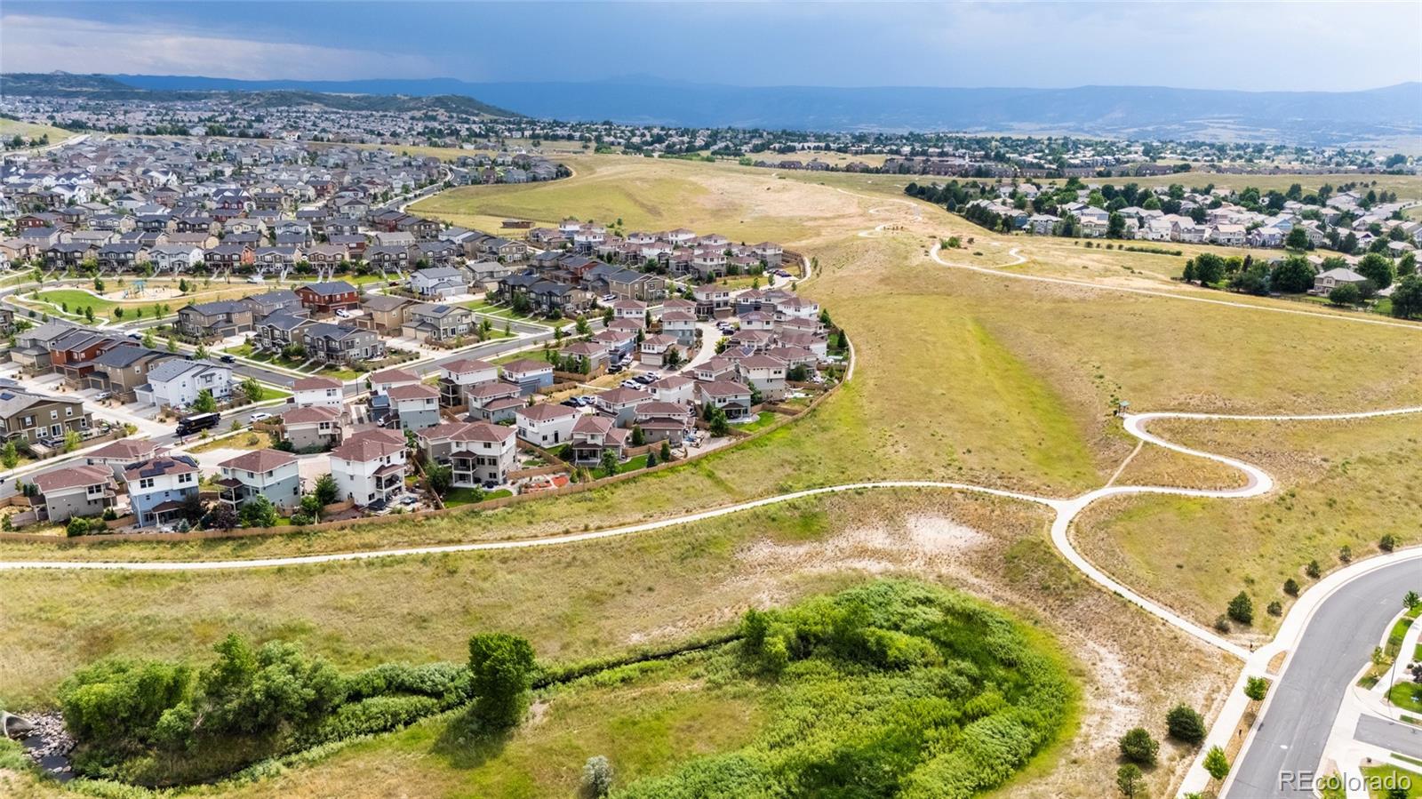 2899 Merry Rest Way Castle Rock, CO 80109 - Photo 37 of 39 a view of a swimming pool with a lake view