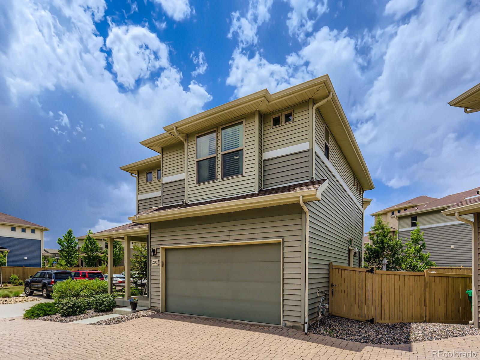 2899 Merry Rest Way Castle Rock, CO 80109 - Photo 5 of 39 a front view of a house with a garage