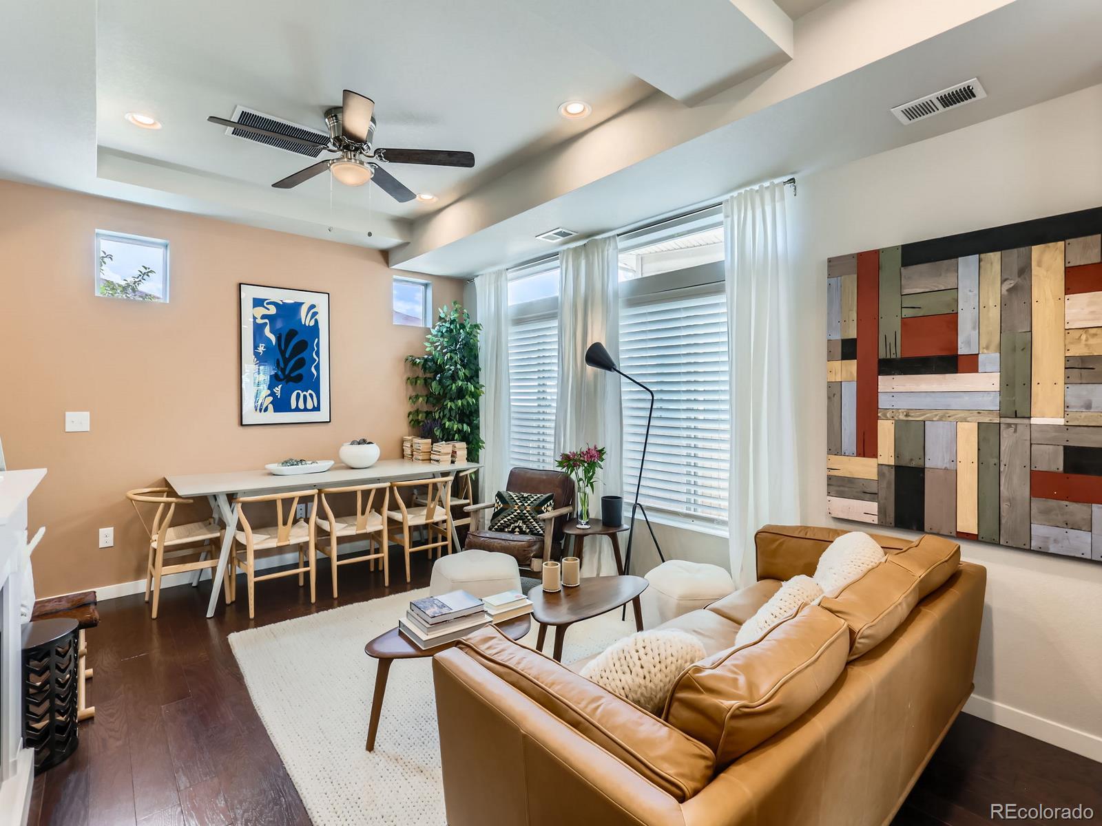 2899 Merry Rest Way Castle Rock, CO 80109 - Photo 8 of 39 a living room with furniture wooden floor and a window