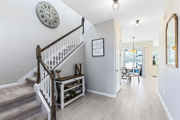 a view of entryway livingroom and hall with wooden floor