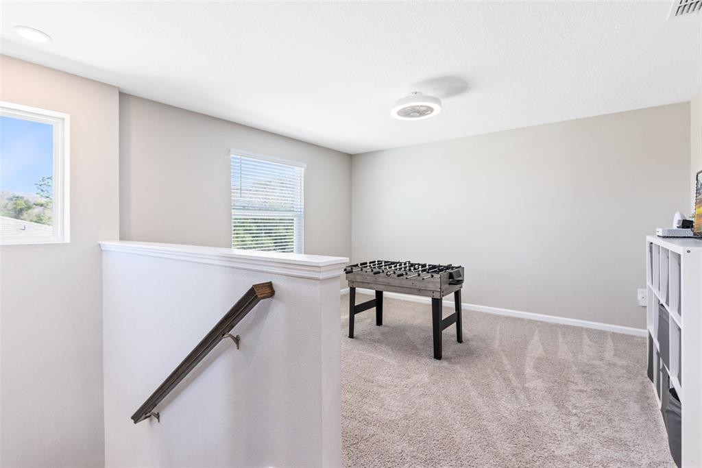4160 Southern Vista Loop St. Cloud, FL 34772 - Photo 14 of 36 a view of a hallway with windows