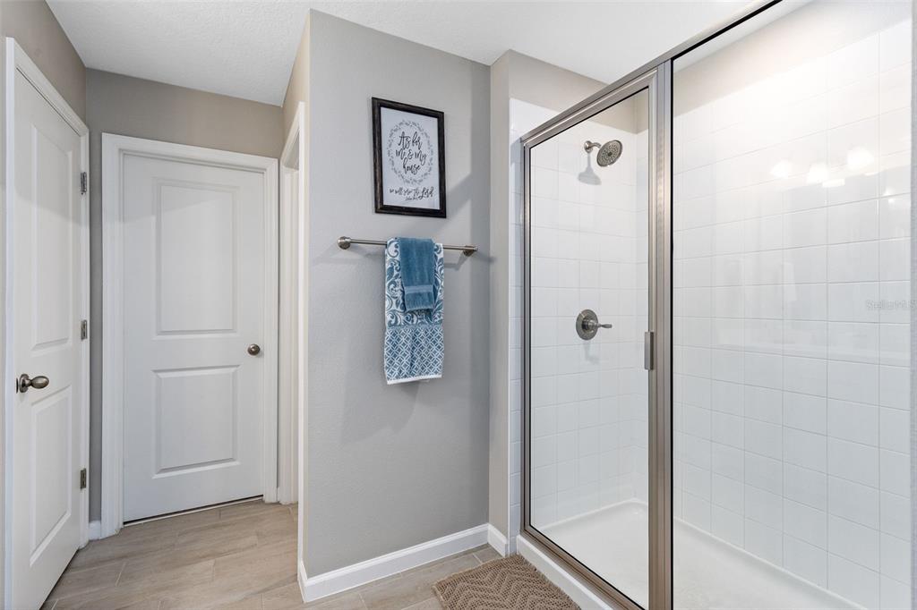 4160 Southern Vista Loop St. Cloud, FL 34772 - Photo 18 of 36 a bathroom with a shower and a sink