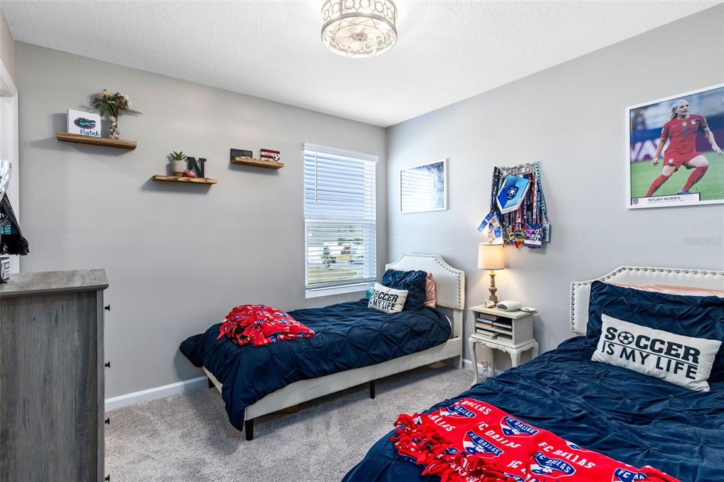 4160 Southern Vista Loop St. Cloud, FL 34772 - Photo 21 of 36 a bedroom with furniture and a couch