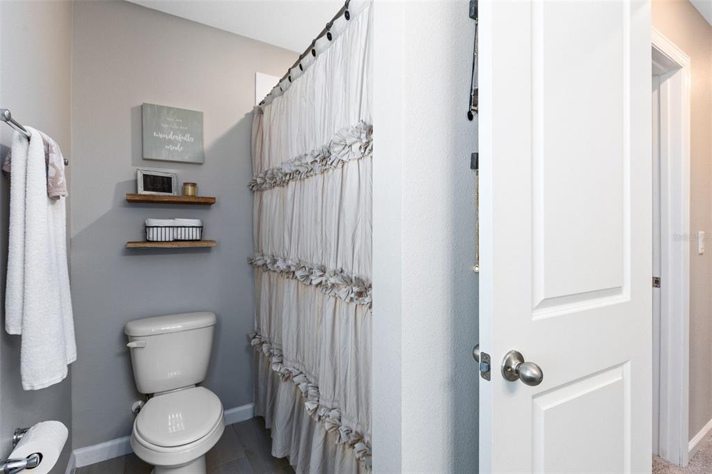 4160 Southern Vista Loop St. Cloud, FL 34772 - Photo 23 of 36 a bathroom with a toilet and a shower