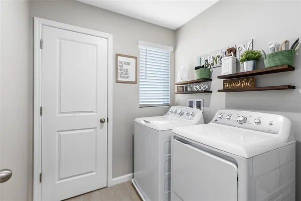 a utility room with dryer and washer
