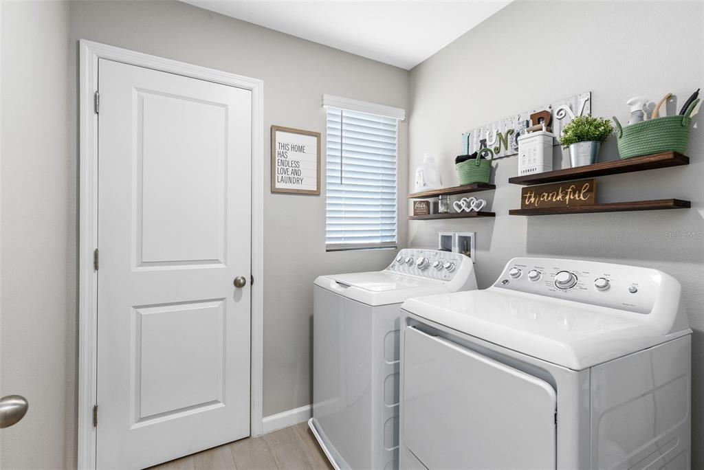 4160 Southern Vista Loop St. Cloud, FL 34772 - Photo 24 of 36 a utility room with dryer and washer