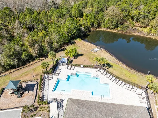 a view of a swimming pool with a patio