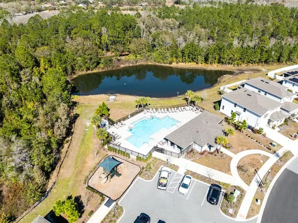 an aerial view of a house with a swimming pool