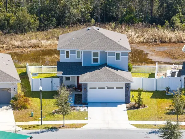 a front view of a house with swimming pool