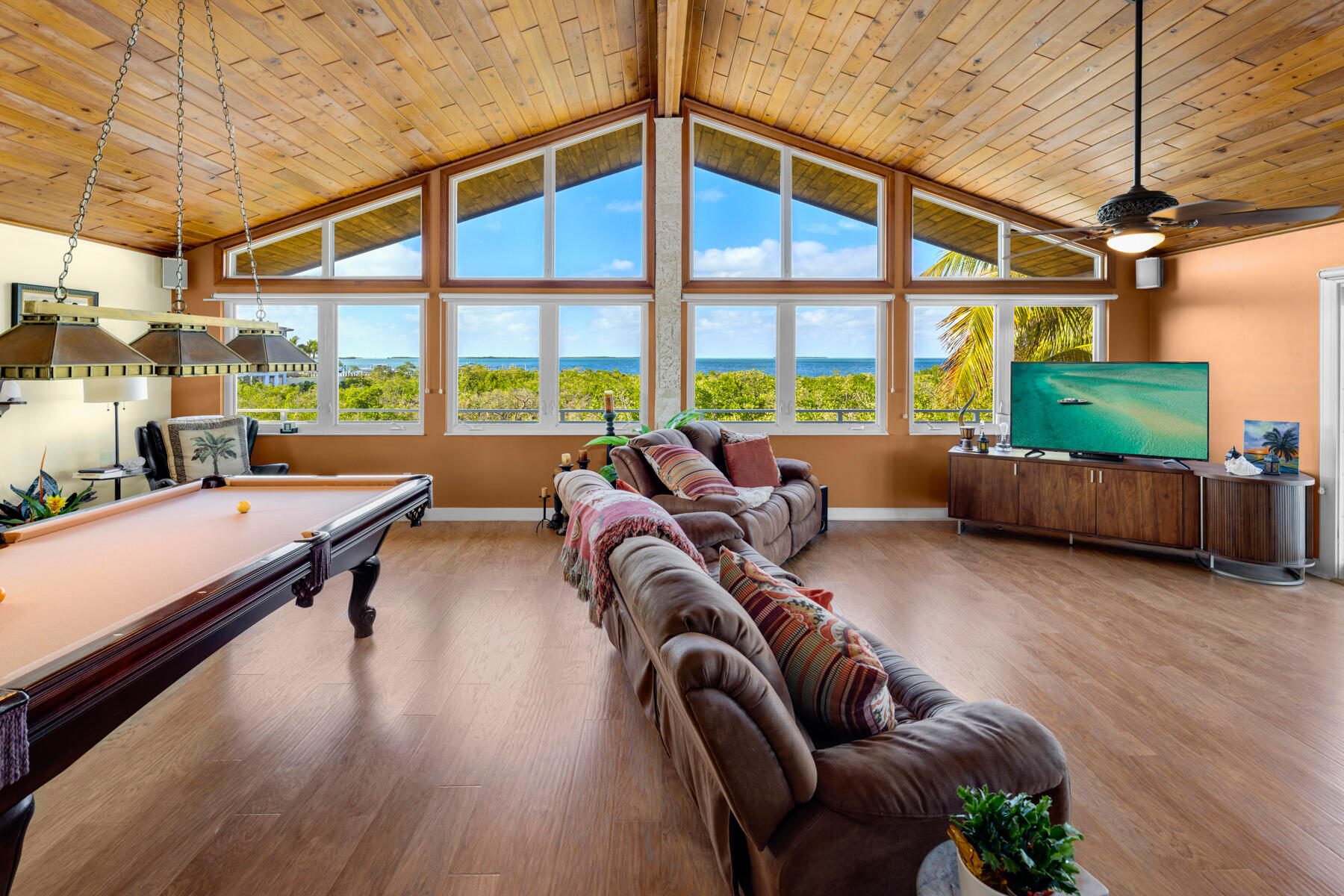 51 Mutiny Place Key Largo, FL 33037 - Photo 17 of 75 a living room filled with furniture and a floor to ceiling window