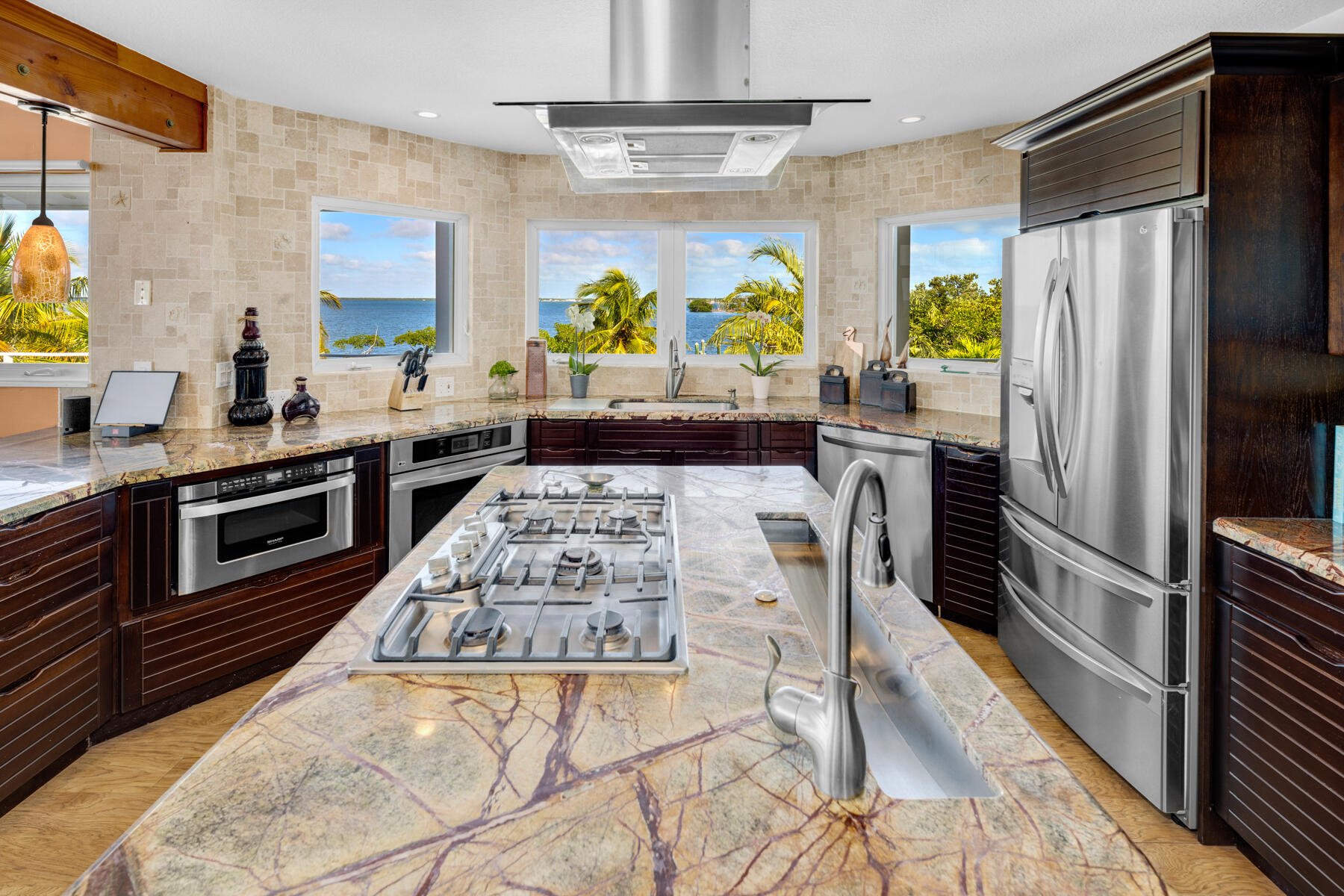 51 Mutiny Place Key Largo, FL 33037 - Photo 22 of 75 a kitchen with stainless steel appliances granite countertop a stove a sink and a refrigerator