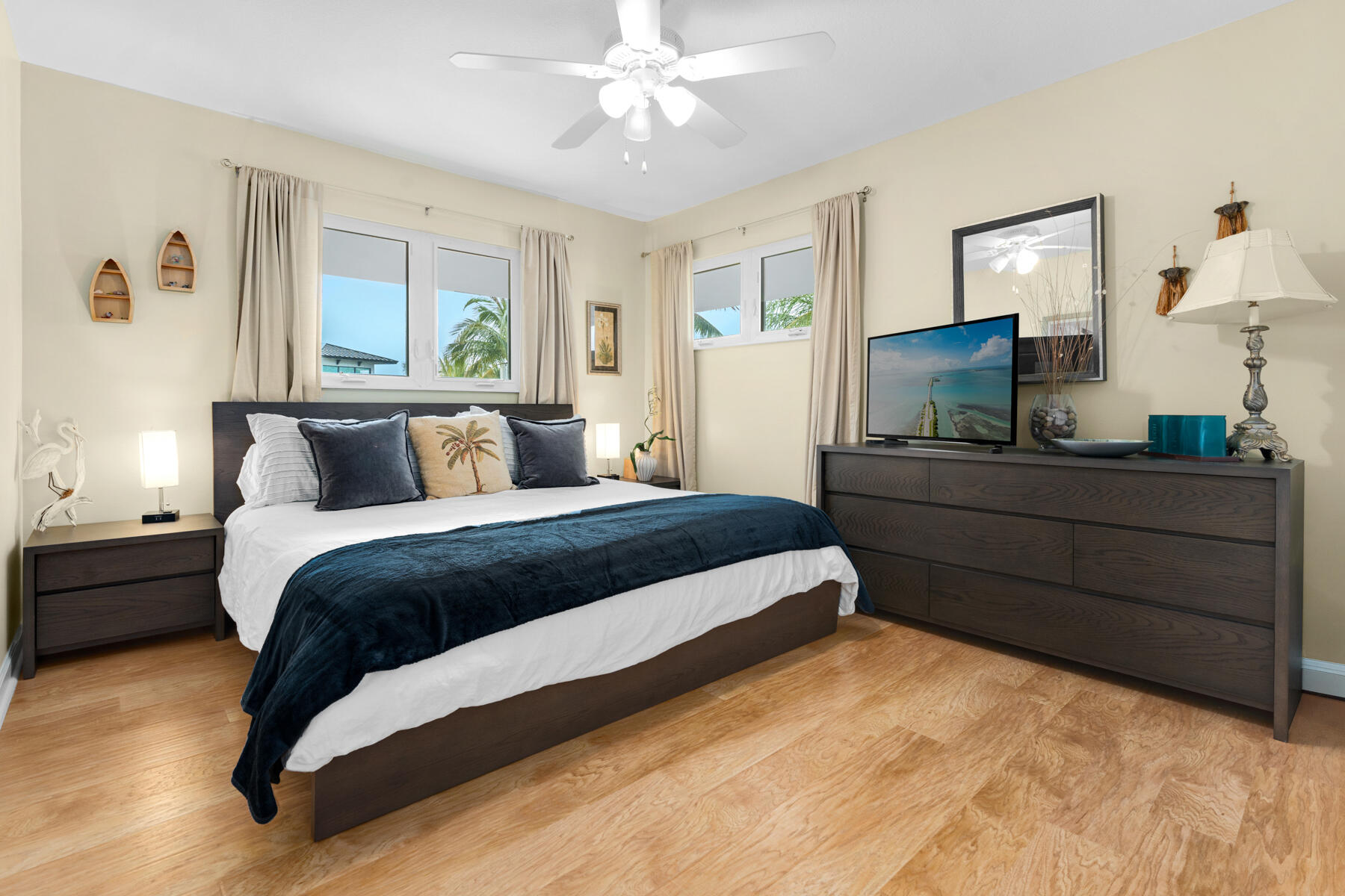 51 Mutiny Place Key Largo, FL 33037 - Photo 40 of 75 a bedroom with a large bed and a flat tv screen on dresser