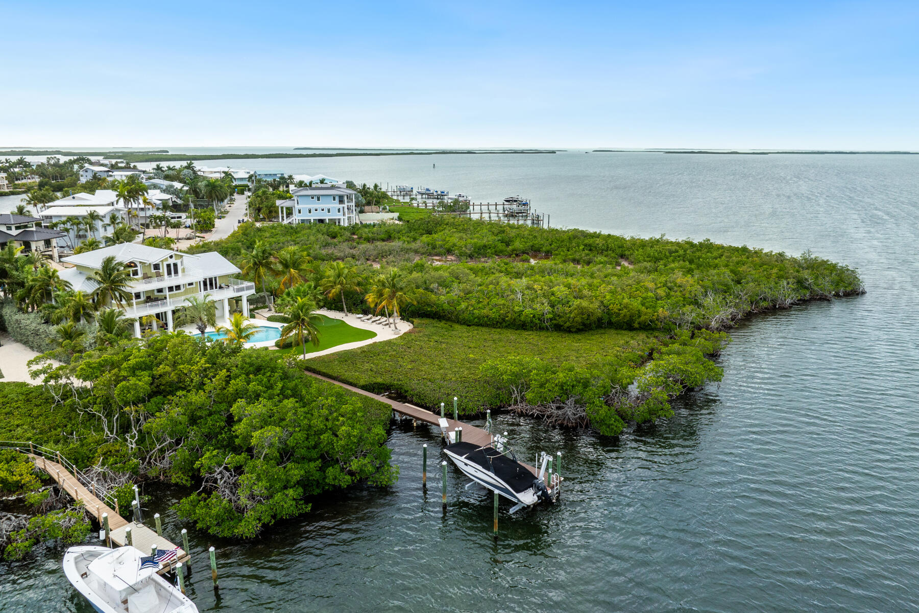 51 Mutiny Place Key Largo, FL 33037 - Photo 71 of 75 a view of a lake with a yard