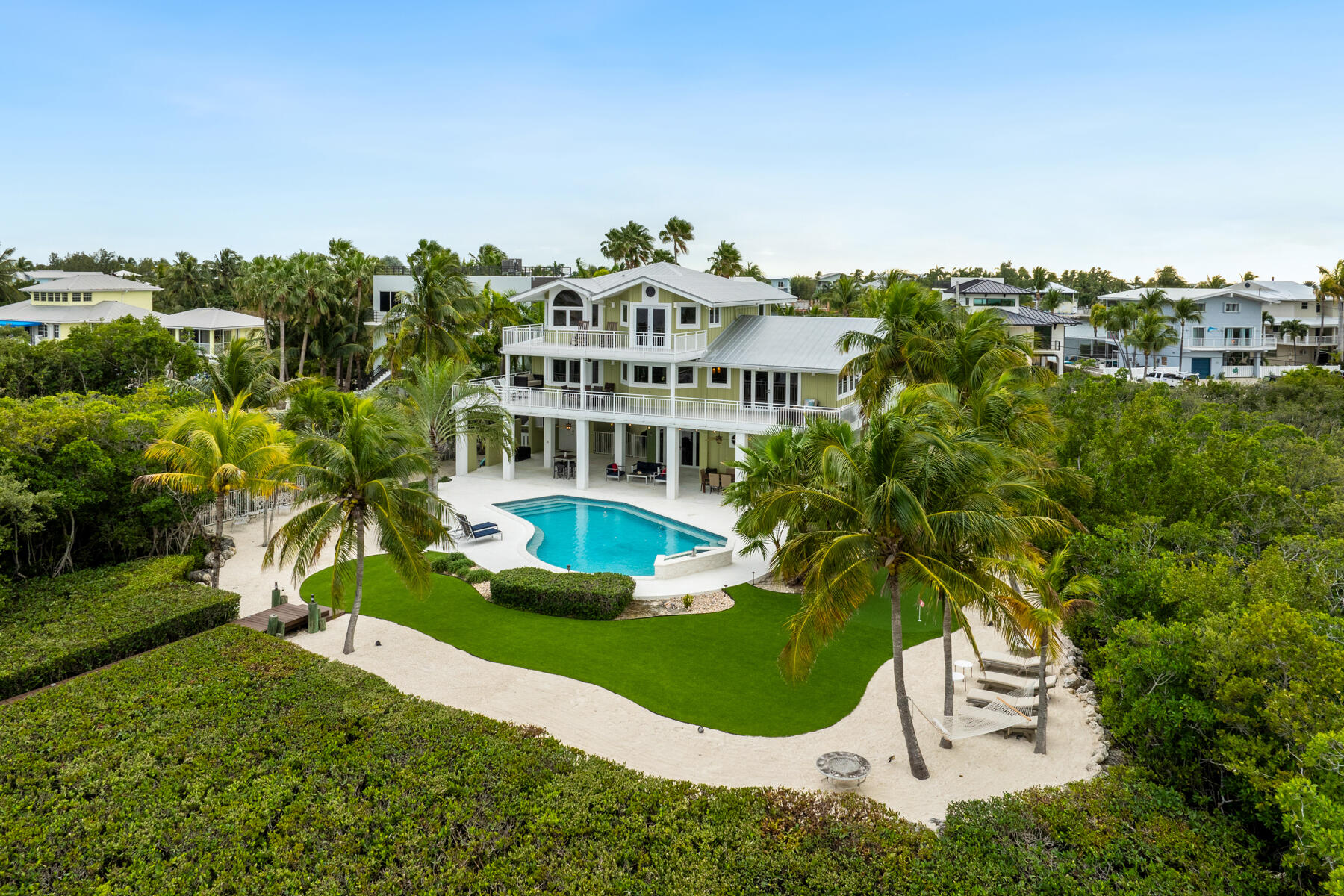 51 Mutiny Place Key Largo, FL 33037 - Photo 9 of 75 a view of a house with a yard and sitting area