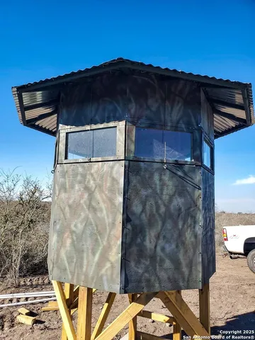 a view of balcony with wooden floor and city view