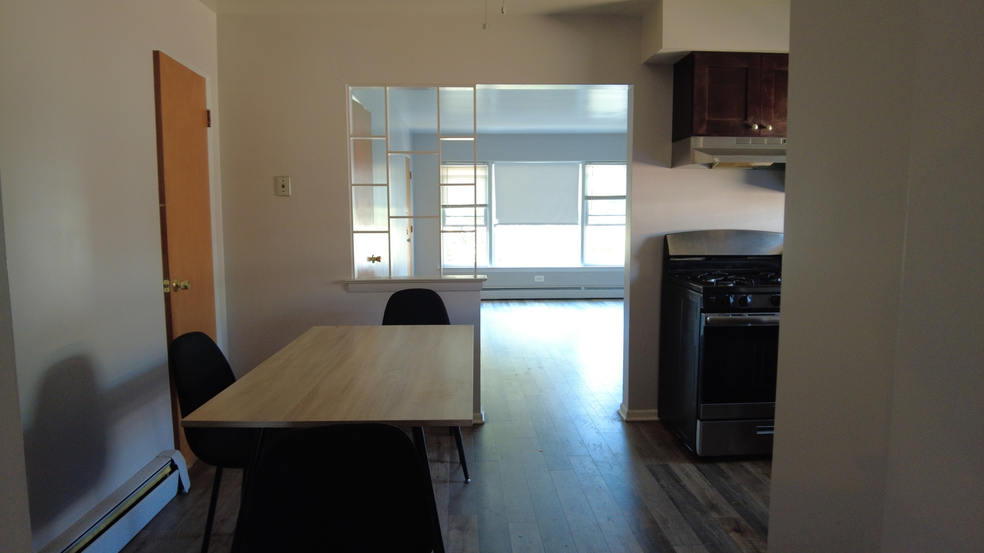 9215 South Pulaski Road, Unit 3N Evergreen Park, IL 60805 - Photo 6 of 8 a view of a dining room with furniture and wooden floor