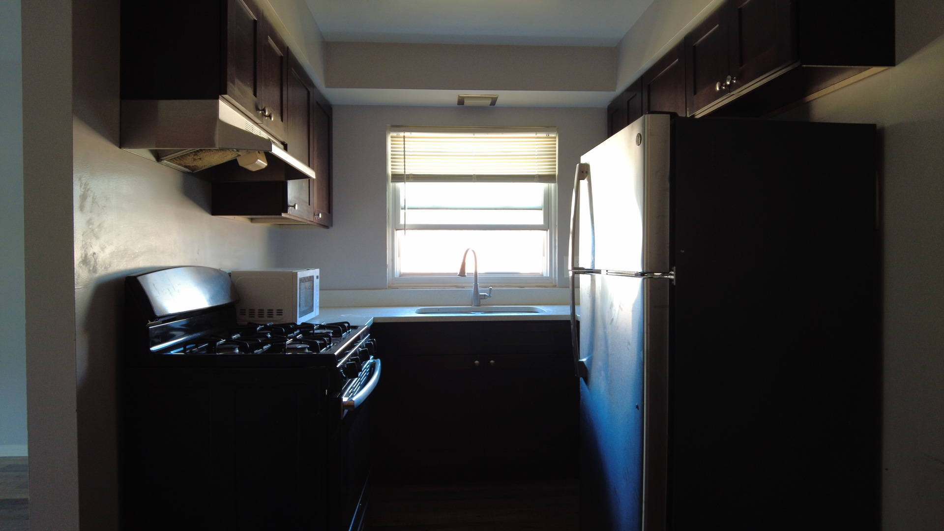 9215 South Pulaski Road, Unit 3N Evergreen Park, IL 60805 - Photo 7 of 8 a kitchen with a sink appliances and cabinets