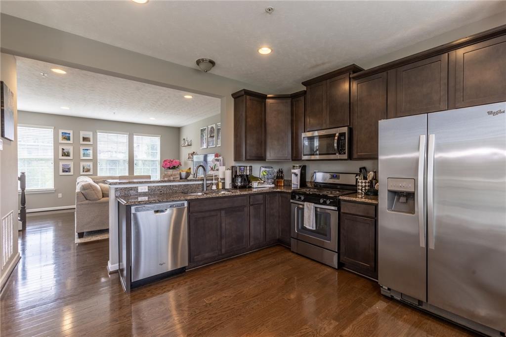 44 Truman Circle McKees Rocks, PA 15136 - Photo 5 of 36 a kitchen with stainless steel appliances granite countertop a refrigerator stove and sink