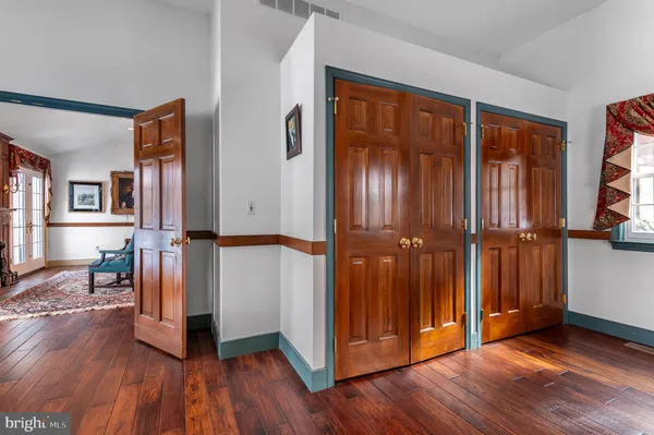 wooden floor in an empty room and a window
