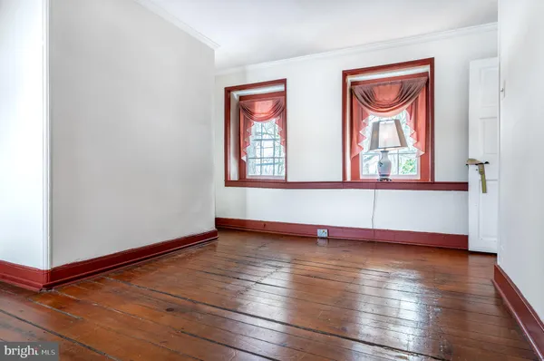 a view of a chairs and table in the balcony