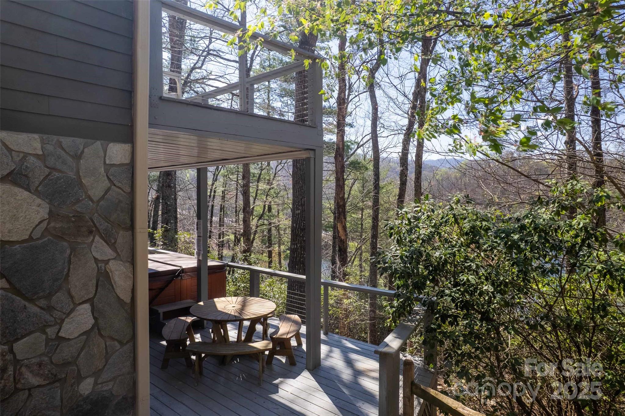 136 Dars Lane Tuckasegee, NC 28783 - Photo 14 of 39 a view of a balcony with chair and wooden floor