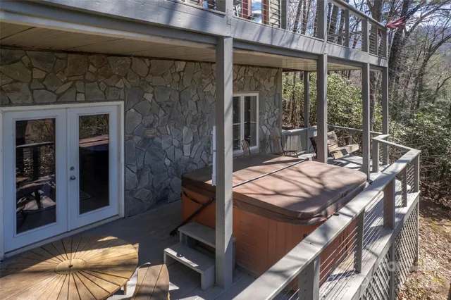 a living room with furniture large window and a fireplace
