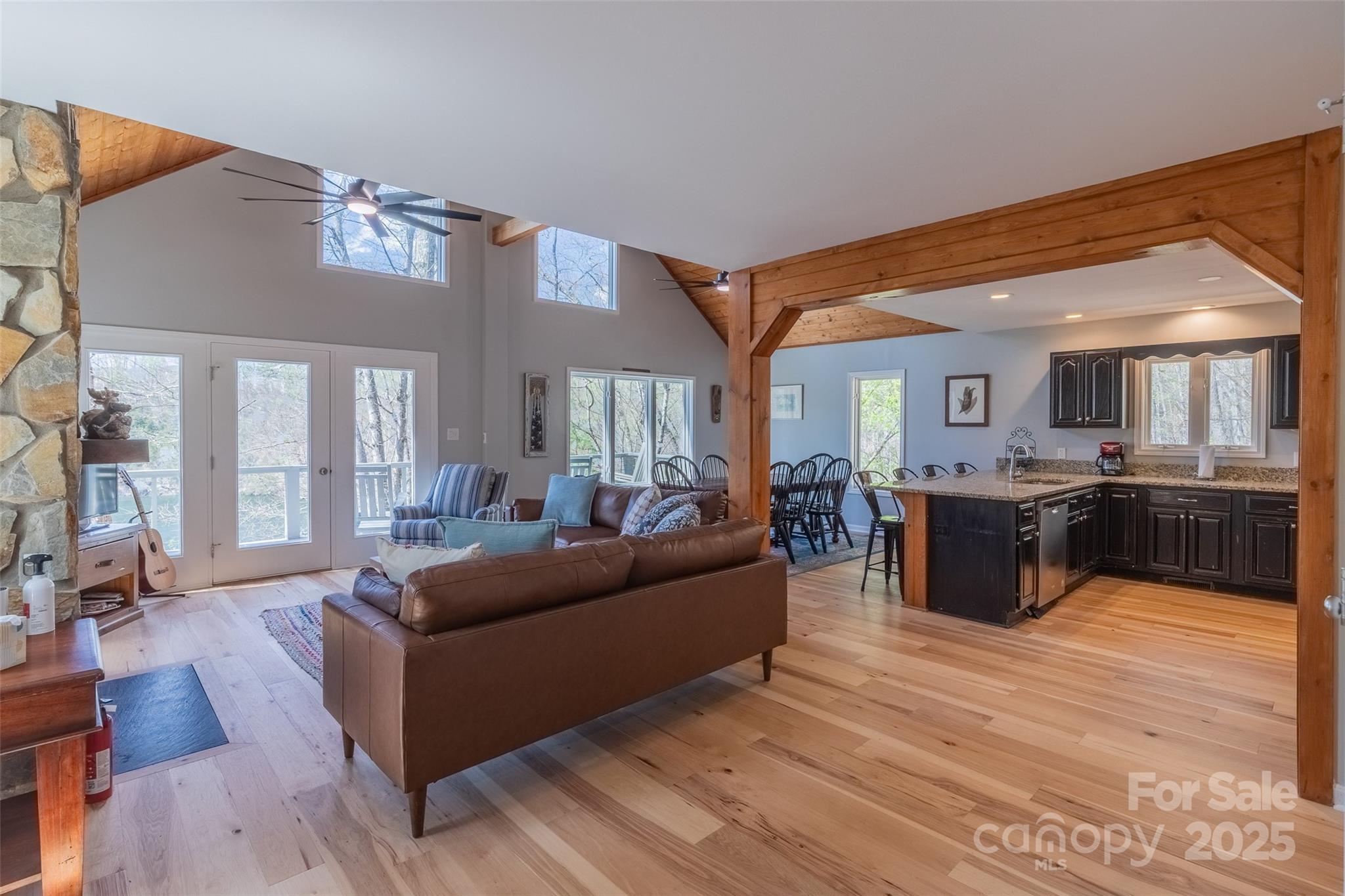 136 Dars Lane Tuckasegee, NC 28783 - Photo 19 of 39 a living room with furniture kitchen view and a large window
