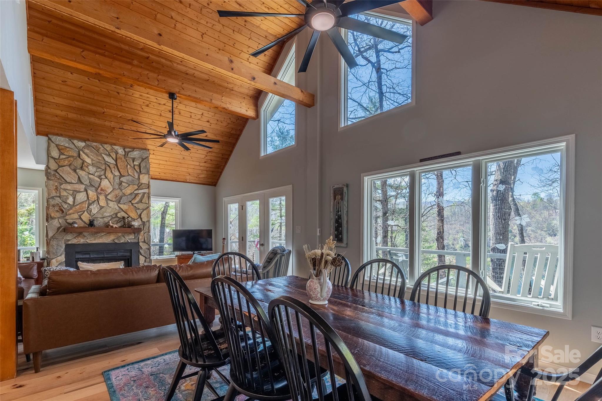 136 Dars Lane Tuckasegee, NC 28783 - Photo 21 of 39 a view of a dining room with furniture window and wooden floor
