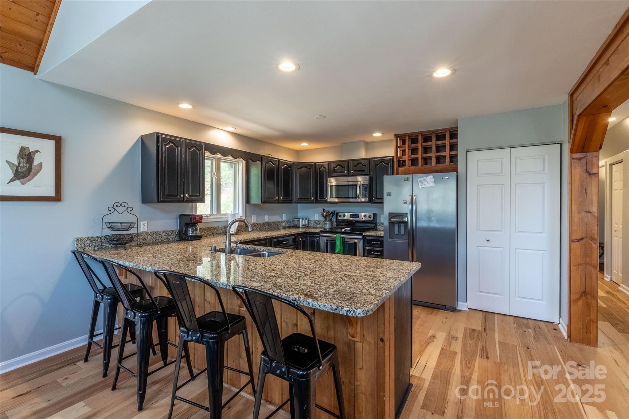 136 Dars Lane Tuckasegee, NC 28783 - Photo 23 of 39 a kitchen with a table and chairs in it