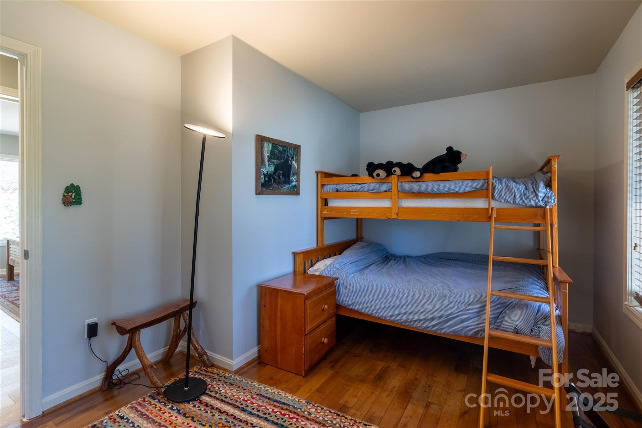 136 Dars Lane Tuckasegee, NC 28783 - Photo 29 of 39 a bed room with a bed and a tv