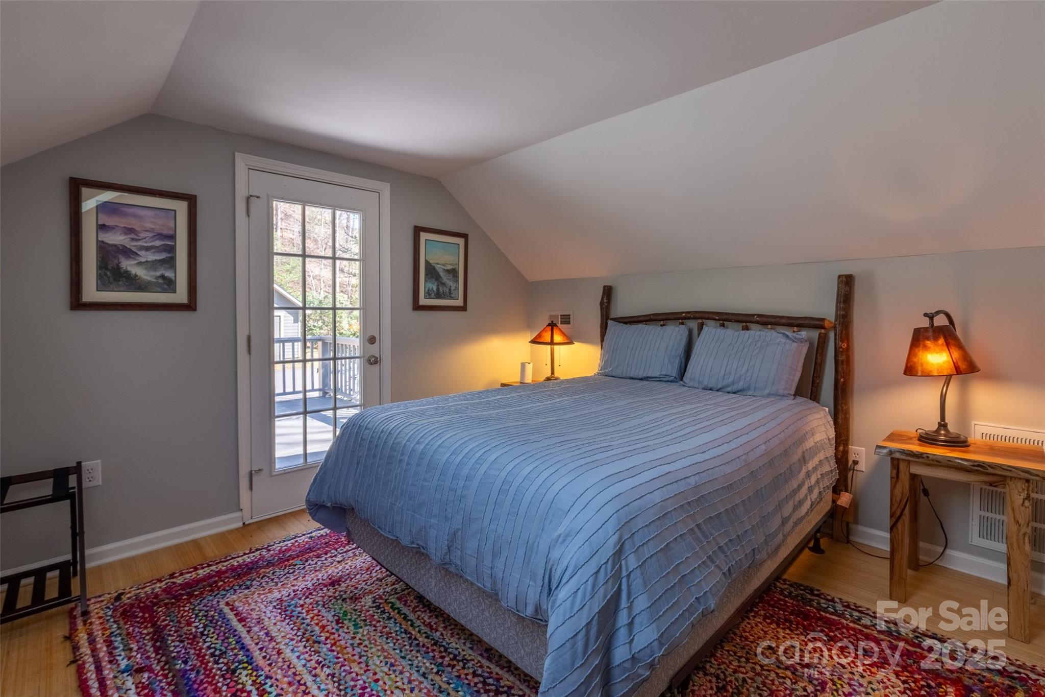 136 Dars Lane Tuckasegee, NC 28783 - Photo 31 of 39 a bedroom with a bed and window