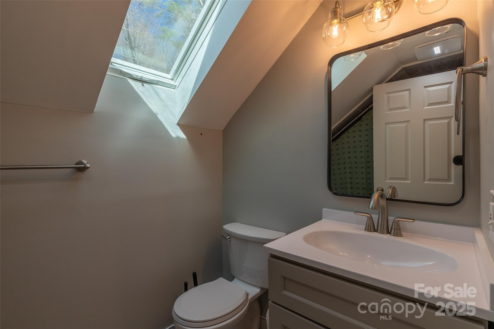136 Dars Lane Tuckasegee, NC 28783 - Photo 32 of 39 a bathroom with a sink and a toilet