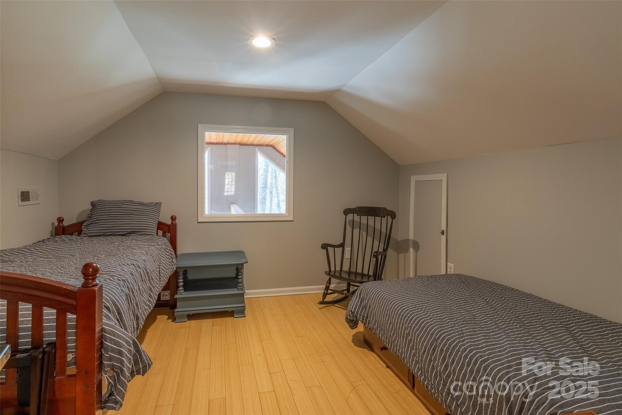 136 Dars Lane Tuckasegee, NC 28783 - Photo 33 of 39 a bedroom with a bed and a table