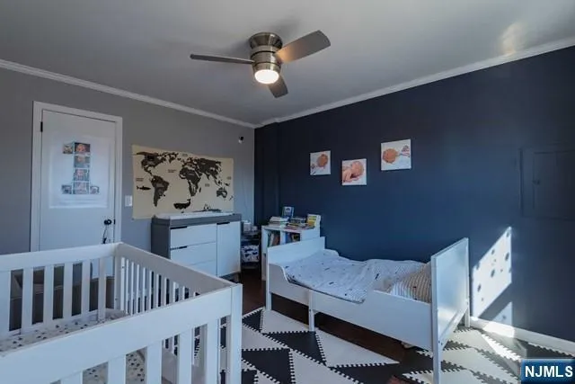 a bedroom with furniture and a chandelier