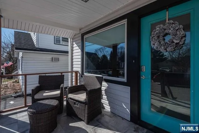 a living room with furniture a front door and a fireplace