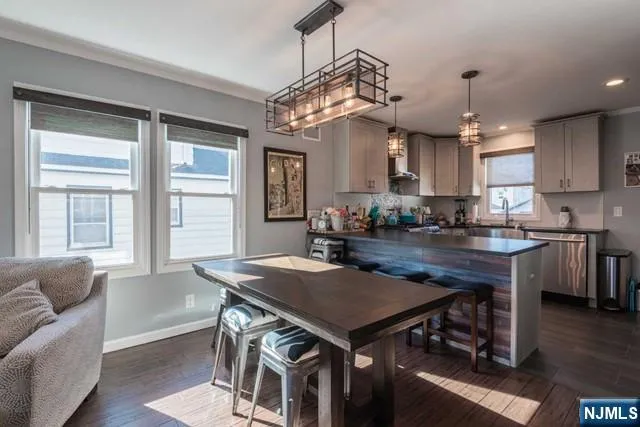 a kitchen with a table and chairs in it