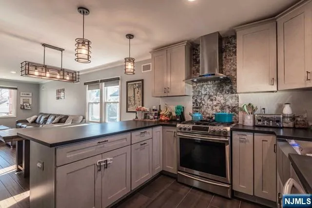 a kitchen with a sink stove and cabinets