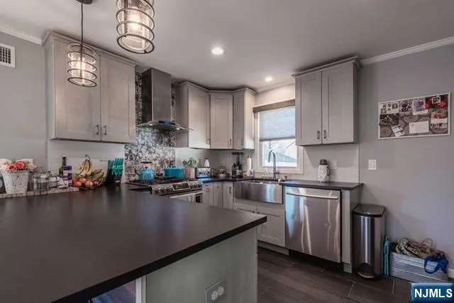 a kitchen with a sink cabinets and window
