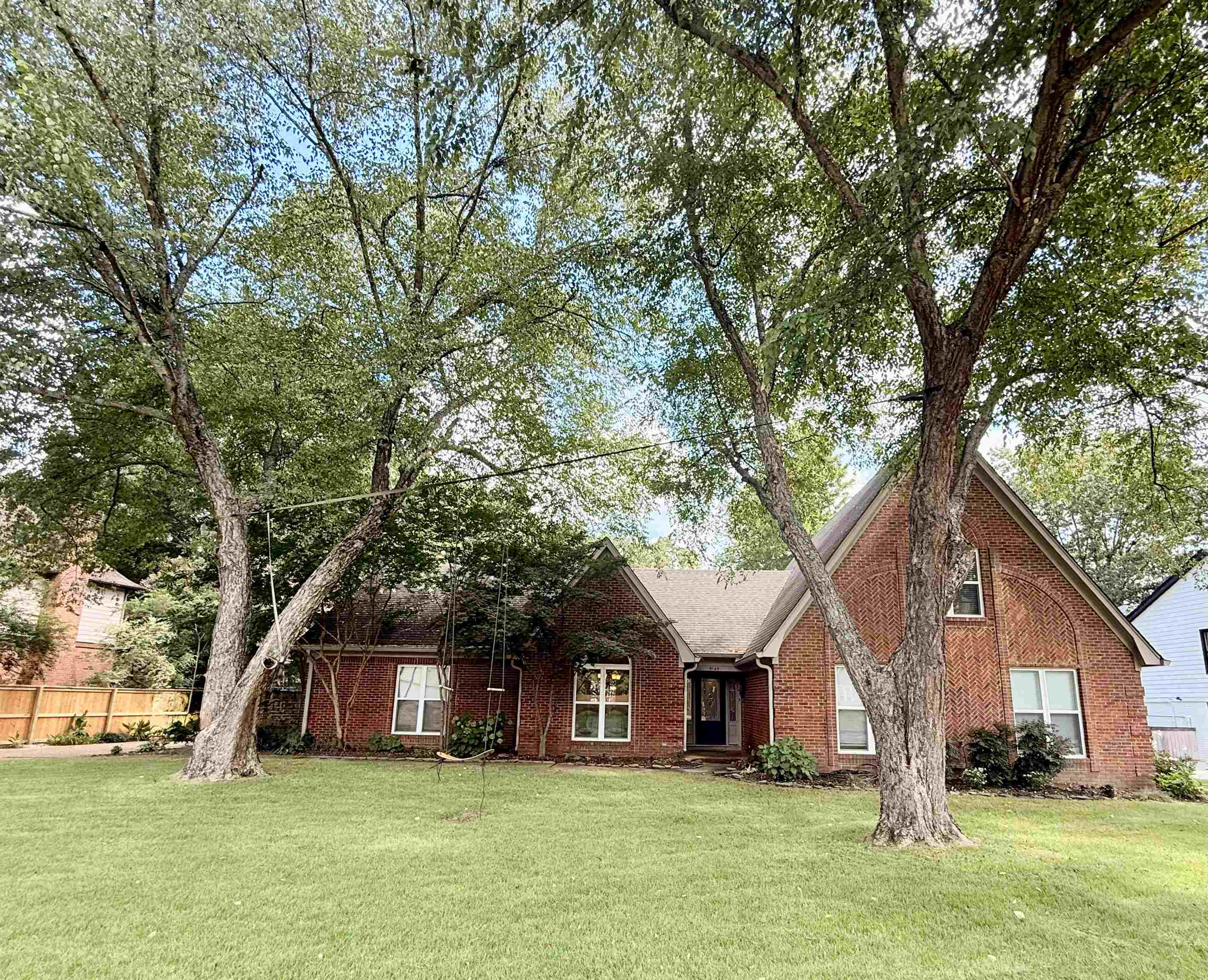 9140 Fox Ridge Road Germantown, TN 38139 - Photo 1 of 23 a front view of a house with a garden