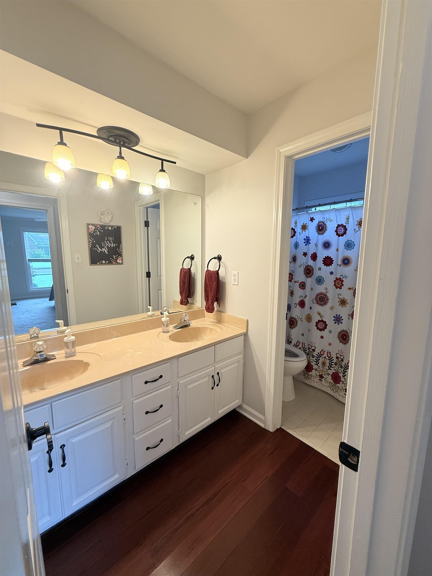9140 Fox Ridge Road Germantown, TN 38139 - Photo 16 of 23 a spacious bathroom with a double vanity sink a mirror and shower