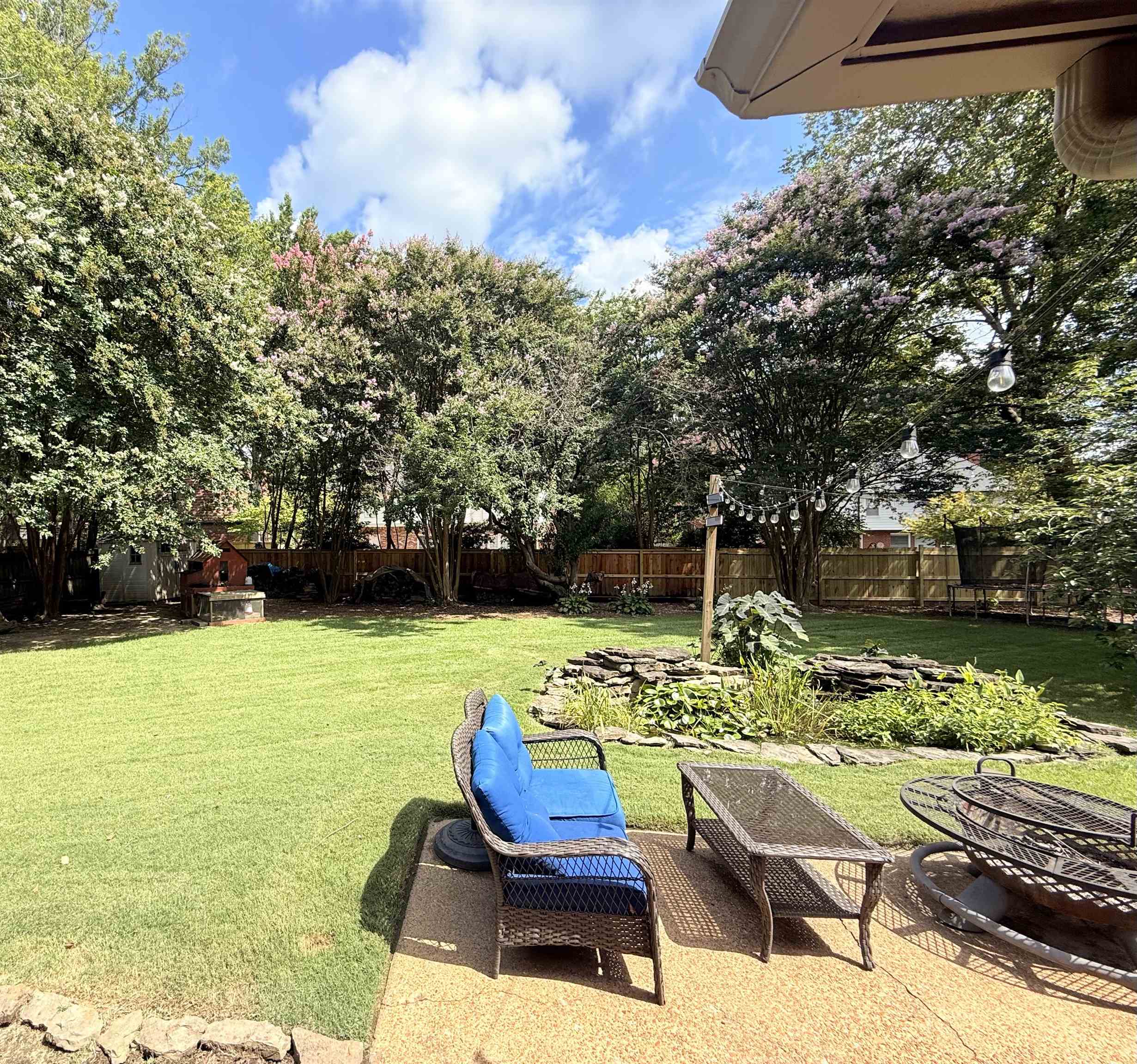 9140 Fox Ridge Road Germantown, TN 38139 - Photo 21 of 23 a view of a chairs and table in the patio next to a yard