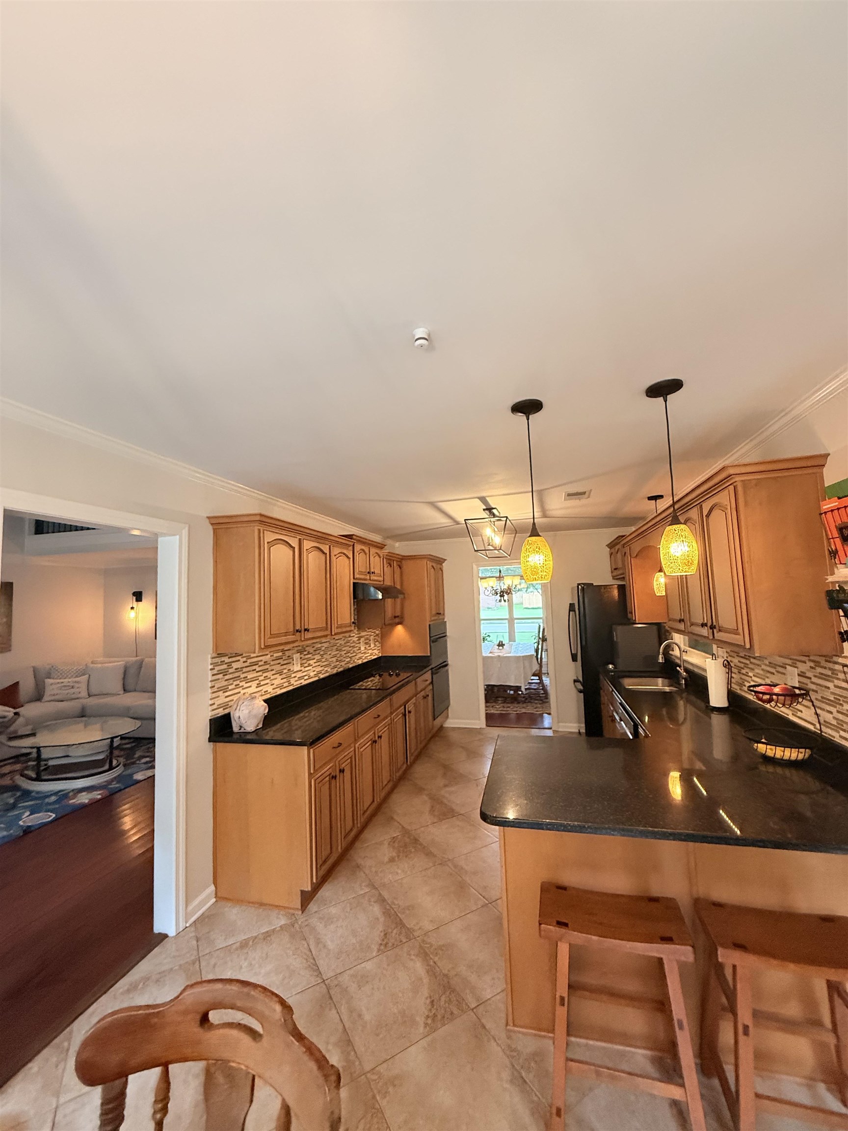 9140 Fox Ridge Road Germantown, TN 38139 - Photo 7 of 23 a kitchen with stainless steel appliances kitchen island granite countertop a sink and cabinets