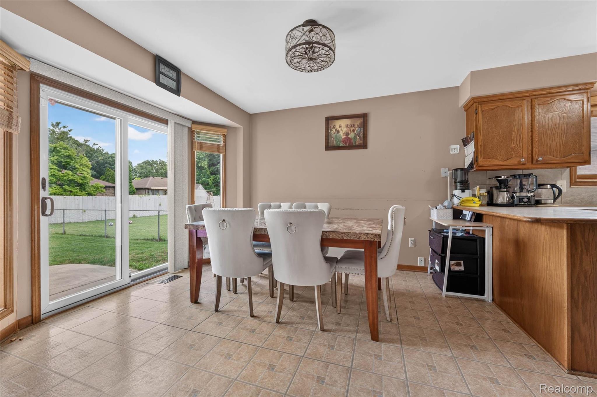46362 Springhill Drive Utica, MI 48317 - Photo 10 of 59 Dining area featuring tiled flooring and a sliding glass door providing backyard access